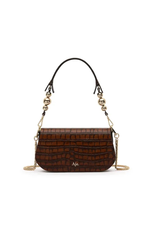 Saturn Clutch sold by Aje