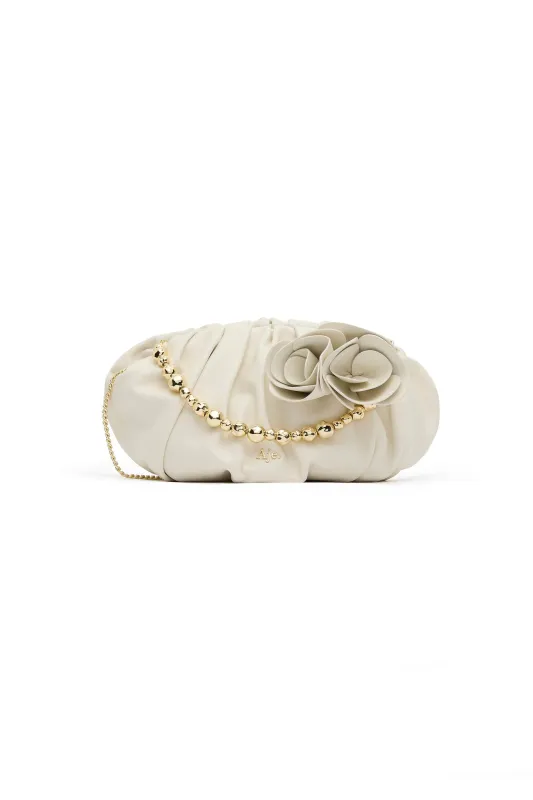 Ari Flower Clutch sold by Aje