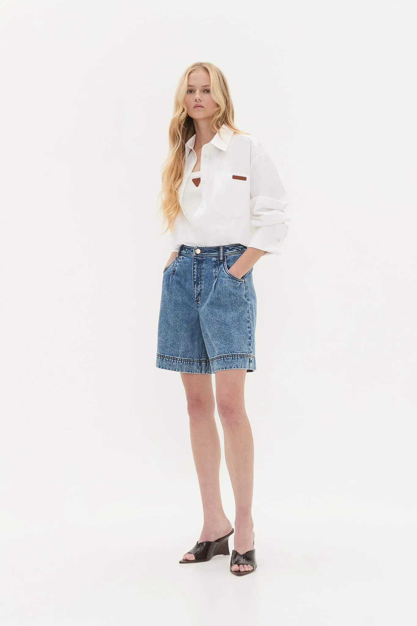 Flynn Longline Denim Short sold by Aje