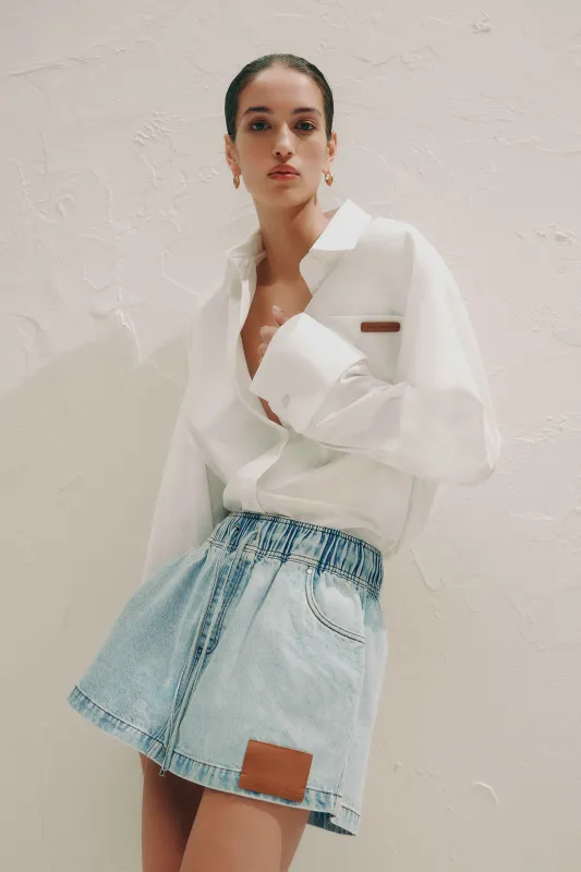 Flynn Denim Mini Skirt sold by Aje