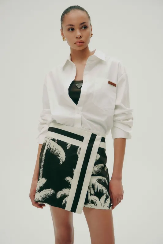 Tansia Wrap Mini Skirt sold by Aje