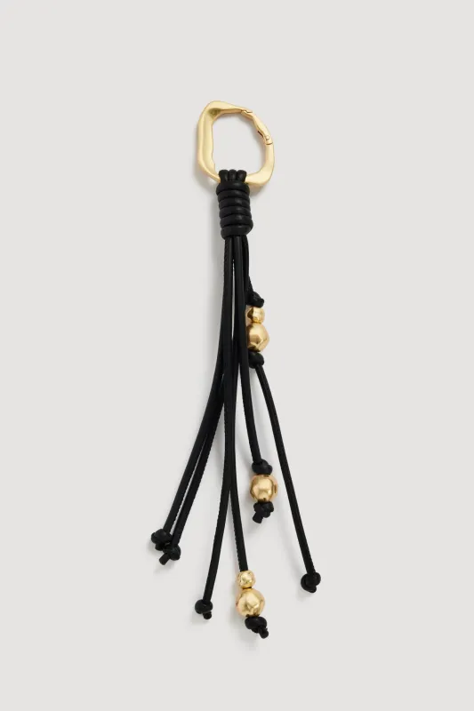 Lucille Key Charm sold by Aje