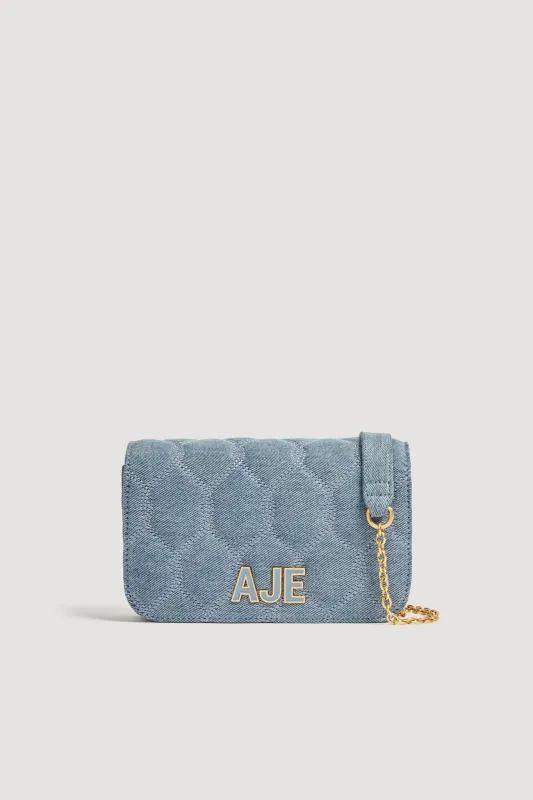 Alita Denim Quilted Clutch sold by Aje