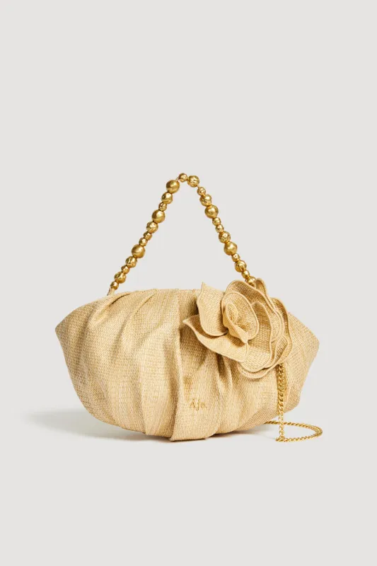 Ari Woven Flower Clutch sold by Aje