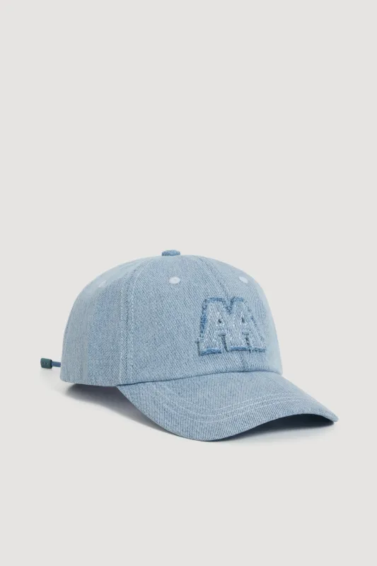 Grayed Denim Cap sold by Aje