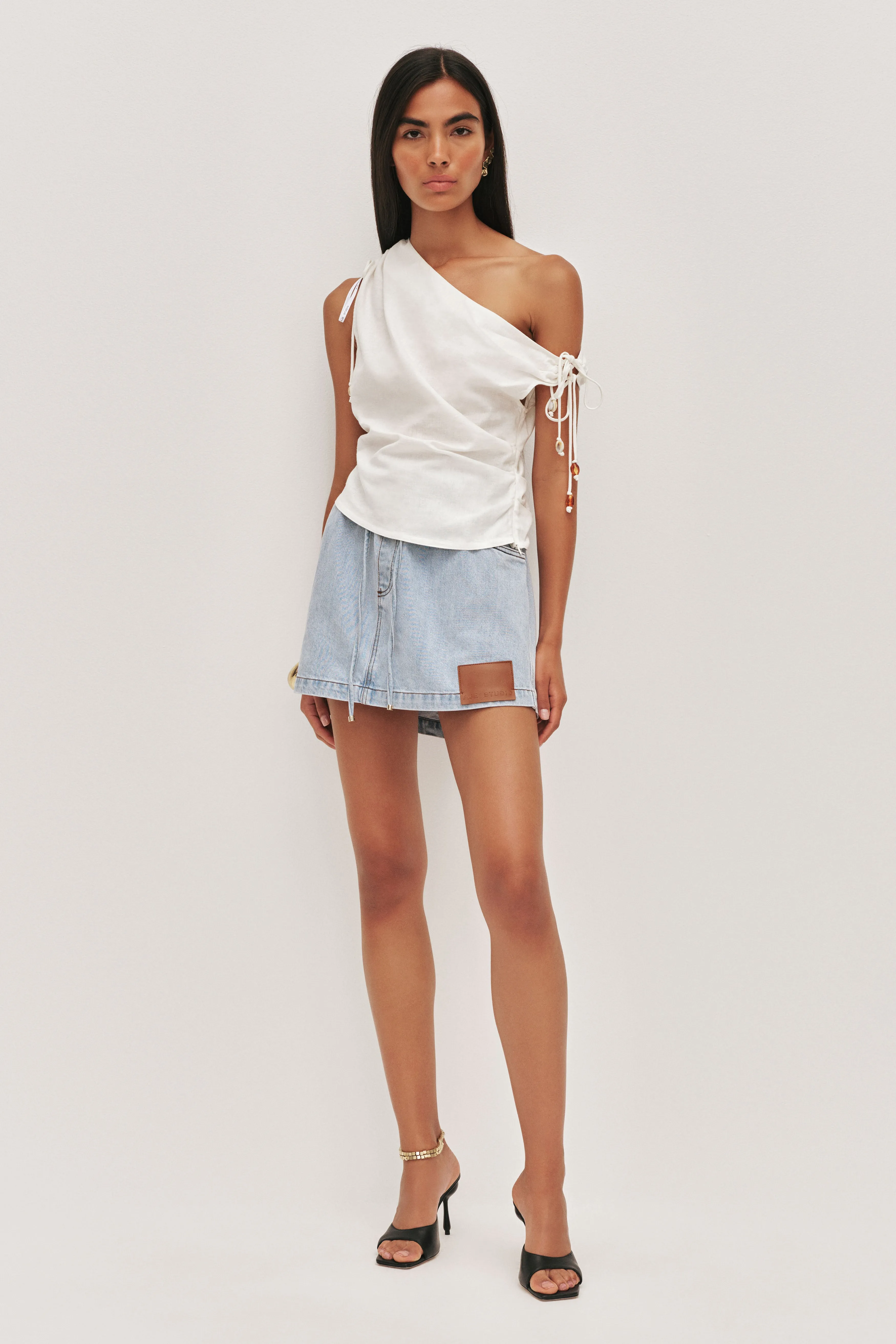 Flynn Denim Mini Skirt sold by Aje