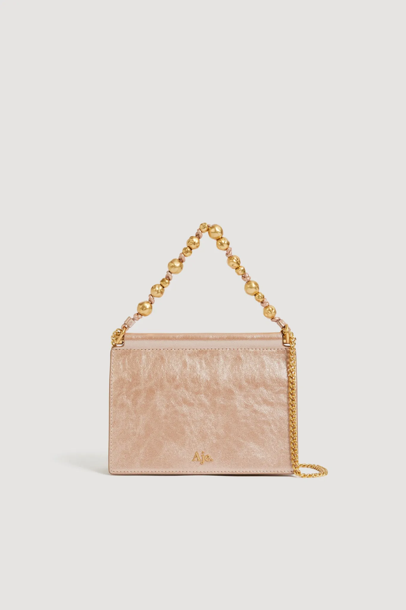 Cece Metallic Clutch sold by Aje