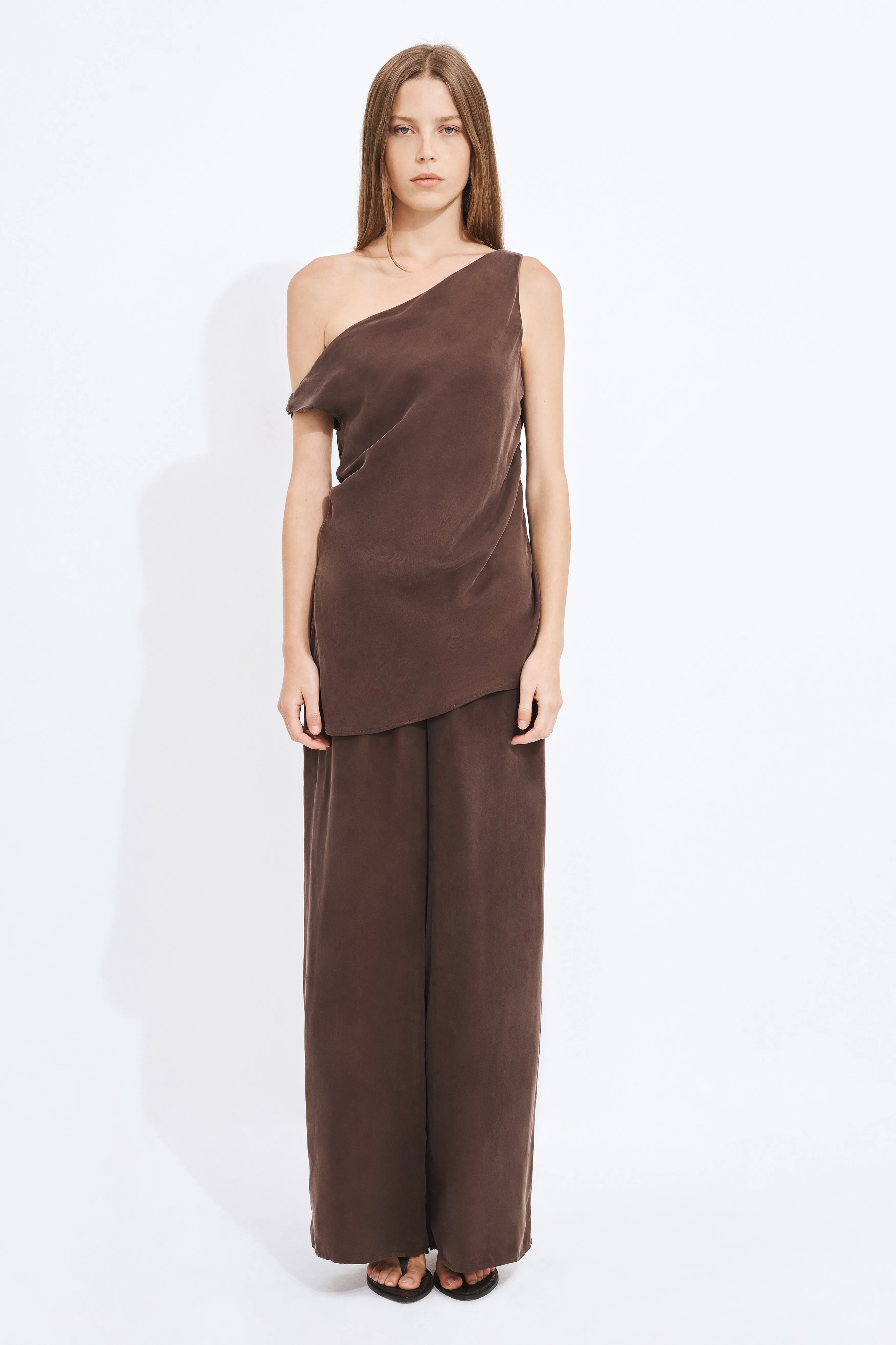 Aeron Asymmetrical Top sold by Aje
