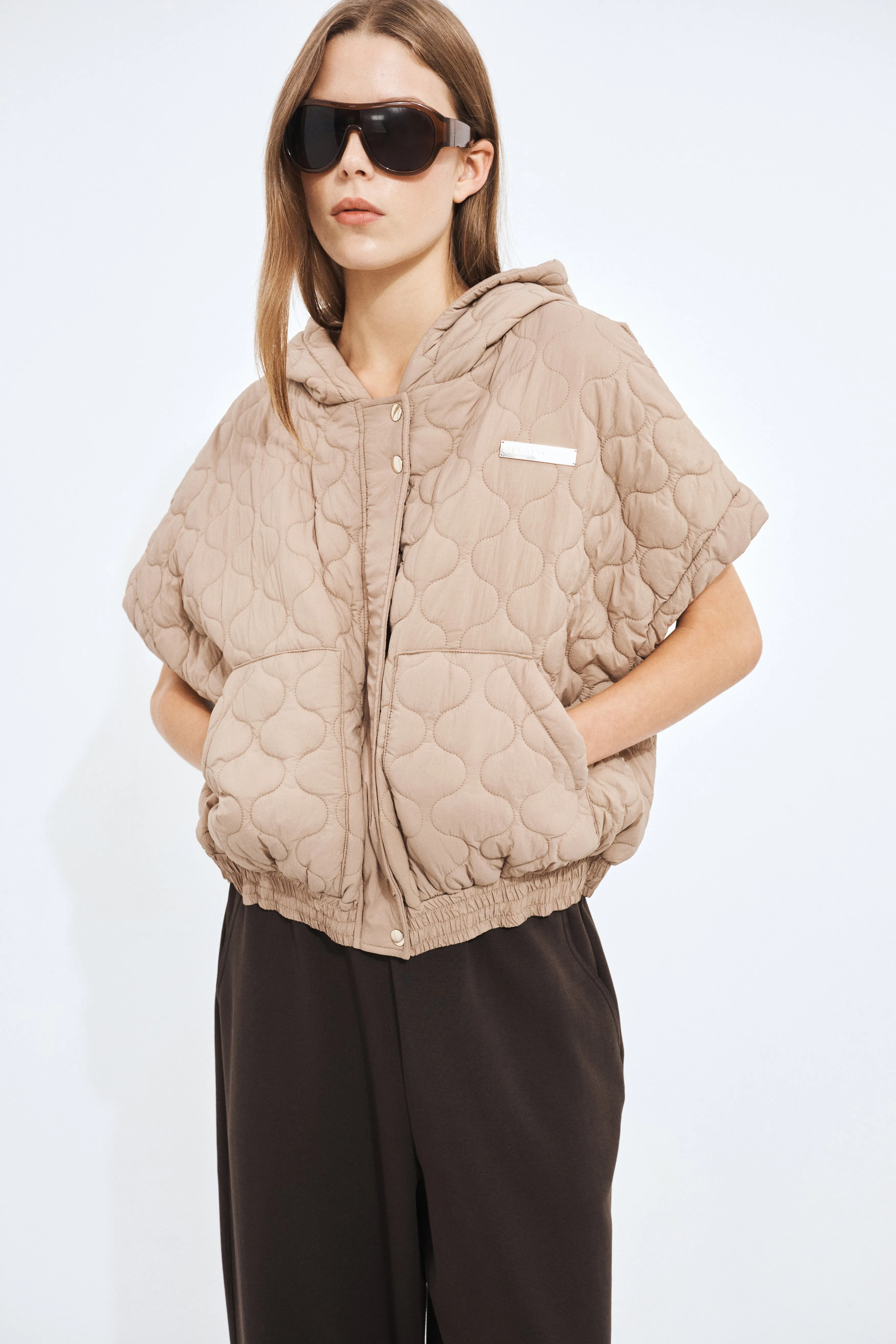 Quilted Crop Vest sold by Aje