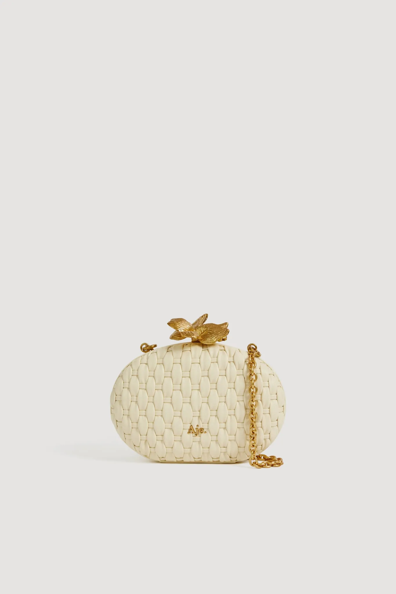 Retrofete Woven Clutch sold by Aje