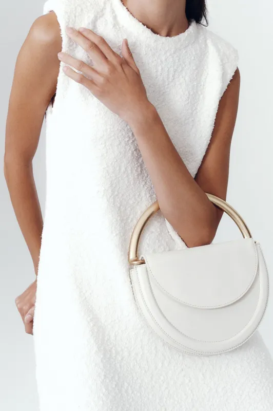 Norma Crescent Clutch sold by Aje