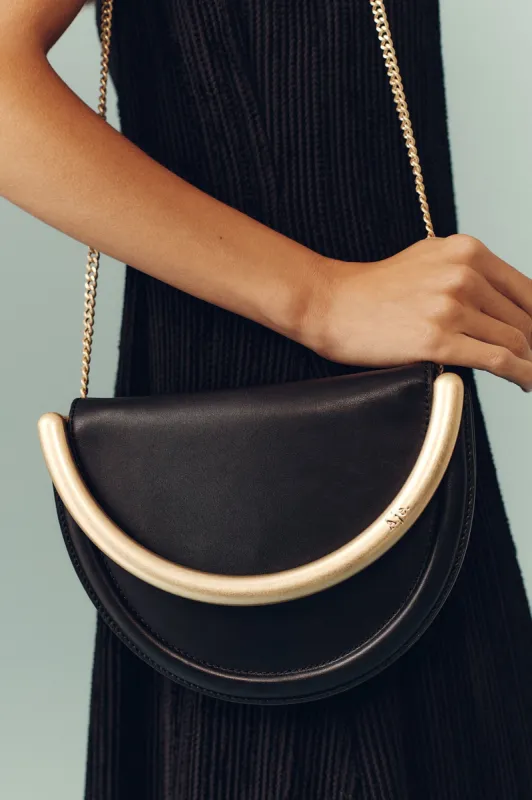Norma Crescent Clutch sold by Aje