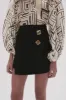 Realm Wrap Front Mini Skirt sold by Aje