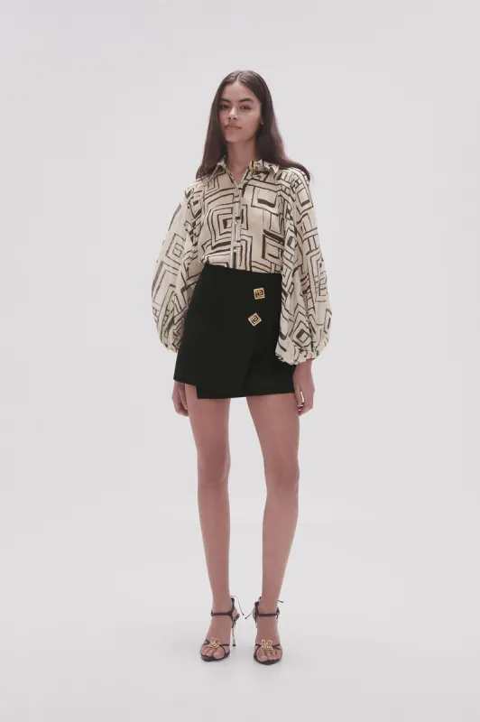 Realm Wrap Front Mini Skirt sold by Aje