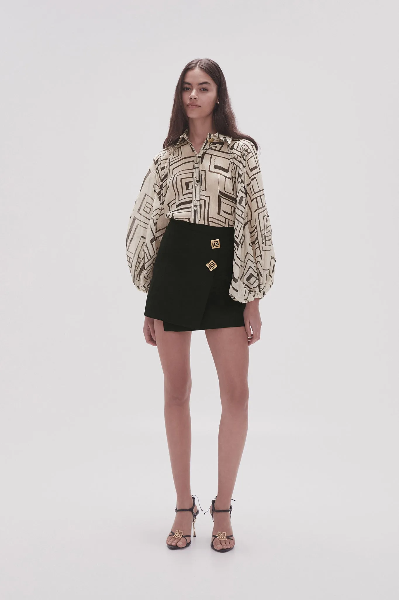 Realm Wrap Front Mini Skirt sold by Aje