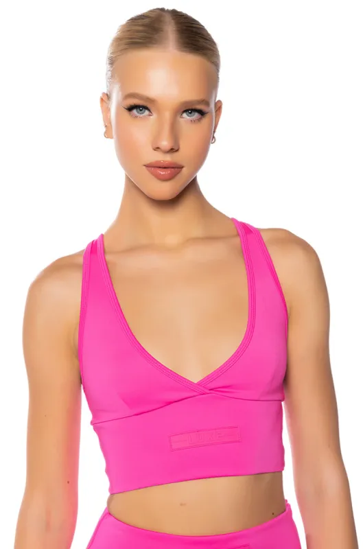 ITS THE PAXTON LUXE LONGLINE BRALETTE IN NEON PINK sold by AKIRA
