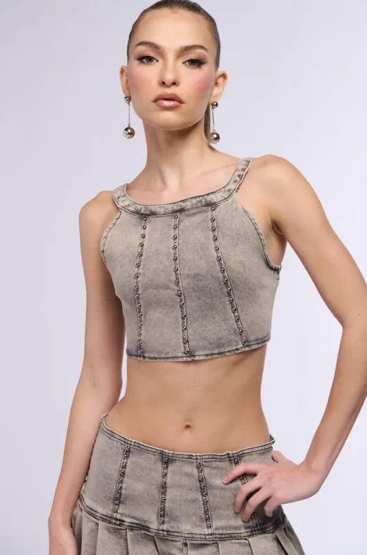 STAND ON MY BUSINESS MINERAL WASH DENIM STUDDED SLEEVELESS TOP sold by AKIRA