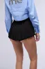 NEVER TOO SHORT MINI SKIRT IN BLACK sold by AKIRA
