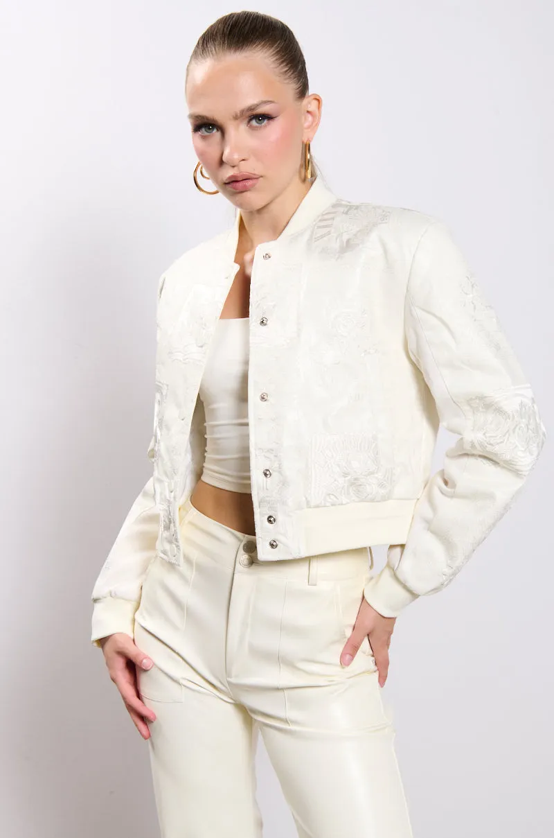 SHE KNOWS EMBROIDERED BOMBER sold by AKIRA