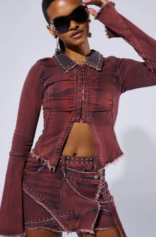 PULL A LOOK DISTRESSED DENIM TOP IN RED sold by AKIRA