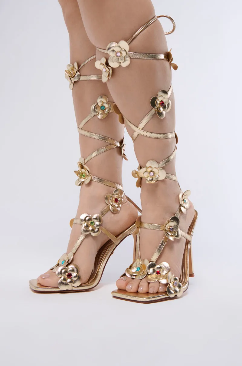 AZALEA WANG ARICHESS GOLD TIE UP FLOWER SANDAL sold by AKIRA