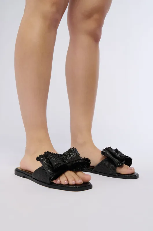 RESORT STAY BLACK BOW FLAT SLIDE sold by AKIRA