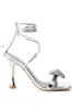 AZALEA WANG APATE EMBELLISHED BOW SANDAL IN SILVER sold by AKIRA