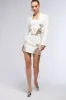 KATY EMBELLISHED MINI SKIRT IN WHITE sold by AKIRA