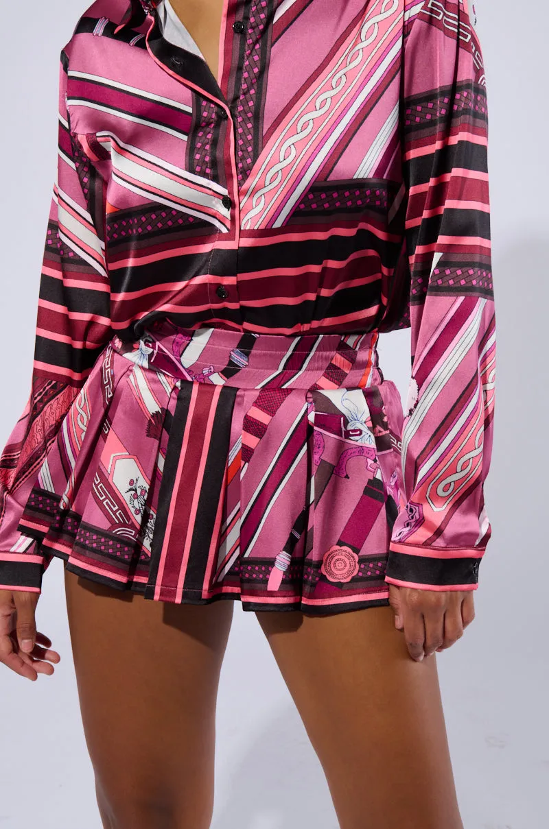 DREAM OF LOVE PLEATED SKIRT sold by AKIRA