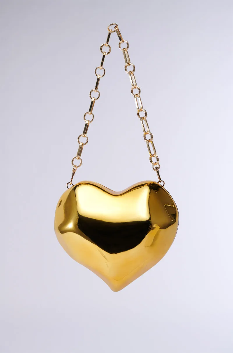 HEART TOO BIG CHROME CLUTCH sold by AKIRA