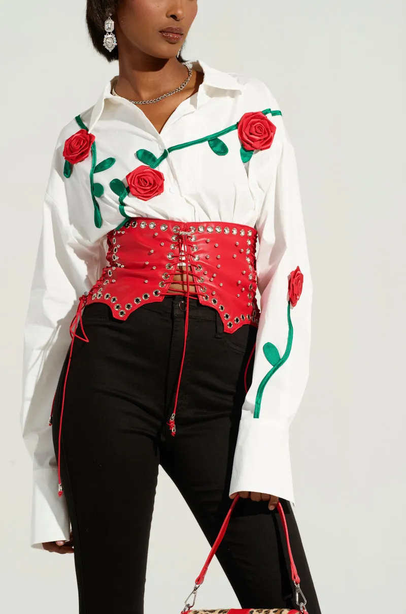 RED ROOM LACE UP BELT sold by AKIRA