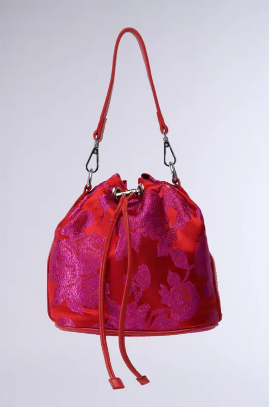 ELEGANCE IS KEY BROCADE BUCKET BAG sold by AKIRA