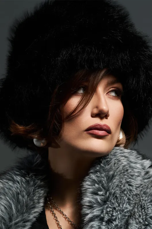 APRES SKI FAUX FUR BUCKET HAT IN BLACK sold by AKIRA