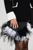 MIXED DECISIONS FEATHER CLUTCH sold by AKIRA