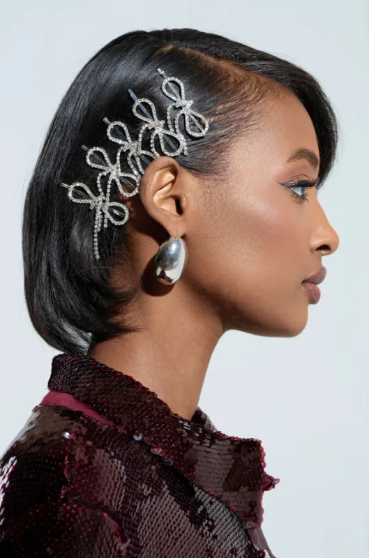 COQUETTE DREAMIN RHINESTONE CLIPS sold by AKIRA