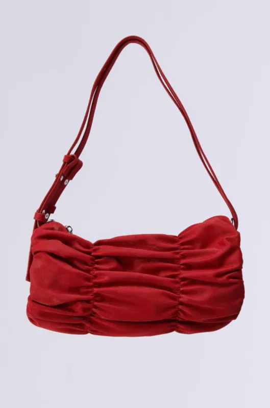 HOT TAMALE RUCHED PURSE sold by AKIRA
