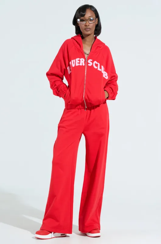 LOVERS CLUB WIDE LEG JOGGER IN RED sold by AKIRA