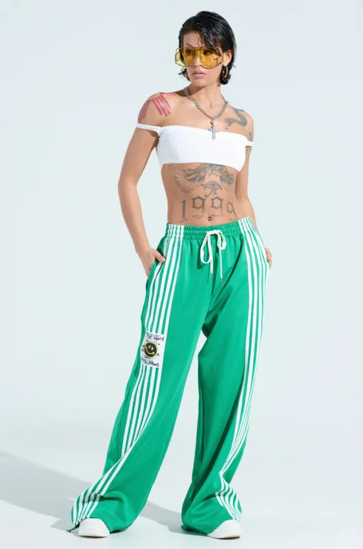 JUMP AROUND WIDE LEG JOGGER IN GREEN sold by AKIRA