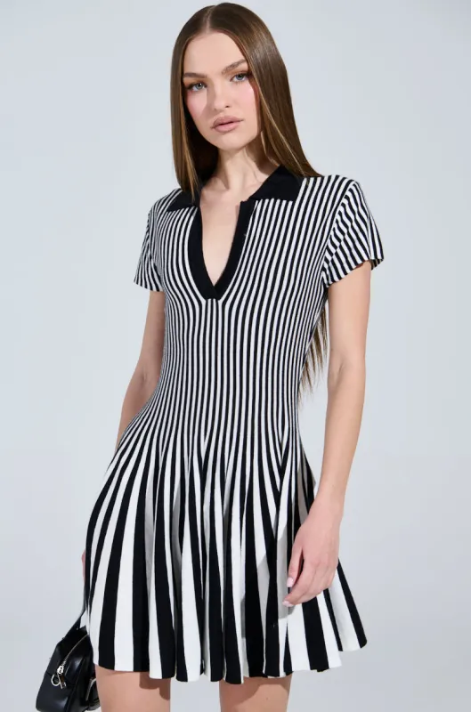 ALINA PLEATED KNIT FIT AND FLARE MINI DRESS IN BLACK AND WHITE sold by AKIRA