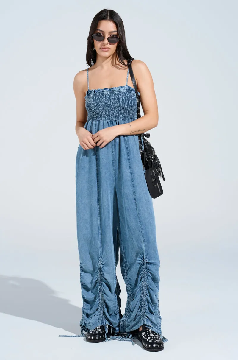 JUMPIN AROUND DENIM JUMPSUIT sold by AKIRA