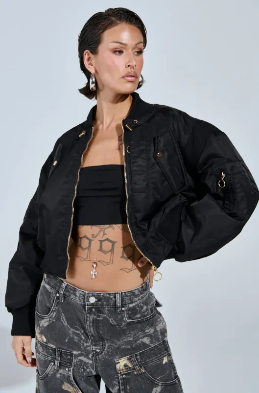 LUCKY ME ASYMMETRICAL BOMBER IN BLACK sold by AKIRA