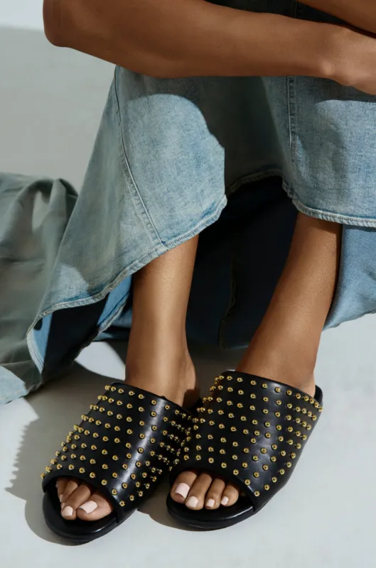 AKIRA  BAGGER STUDDED SLIP ON SANDAL IN BLACK sold by AKIRA