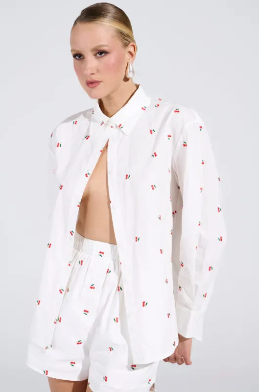 FLOWER WOMAN BUTTON DOWN TOP sold by AKIRA