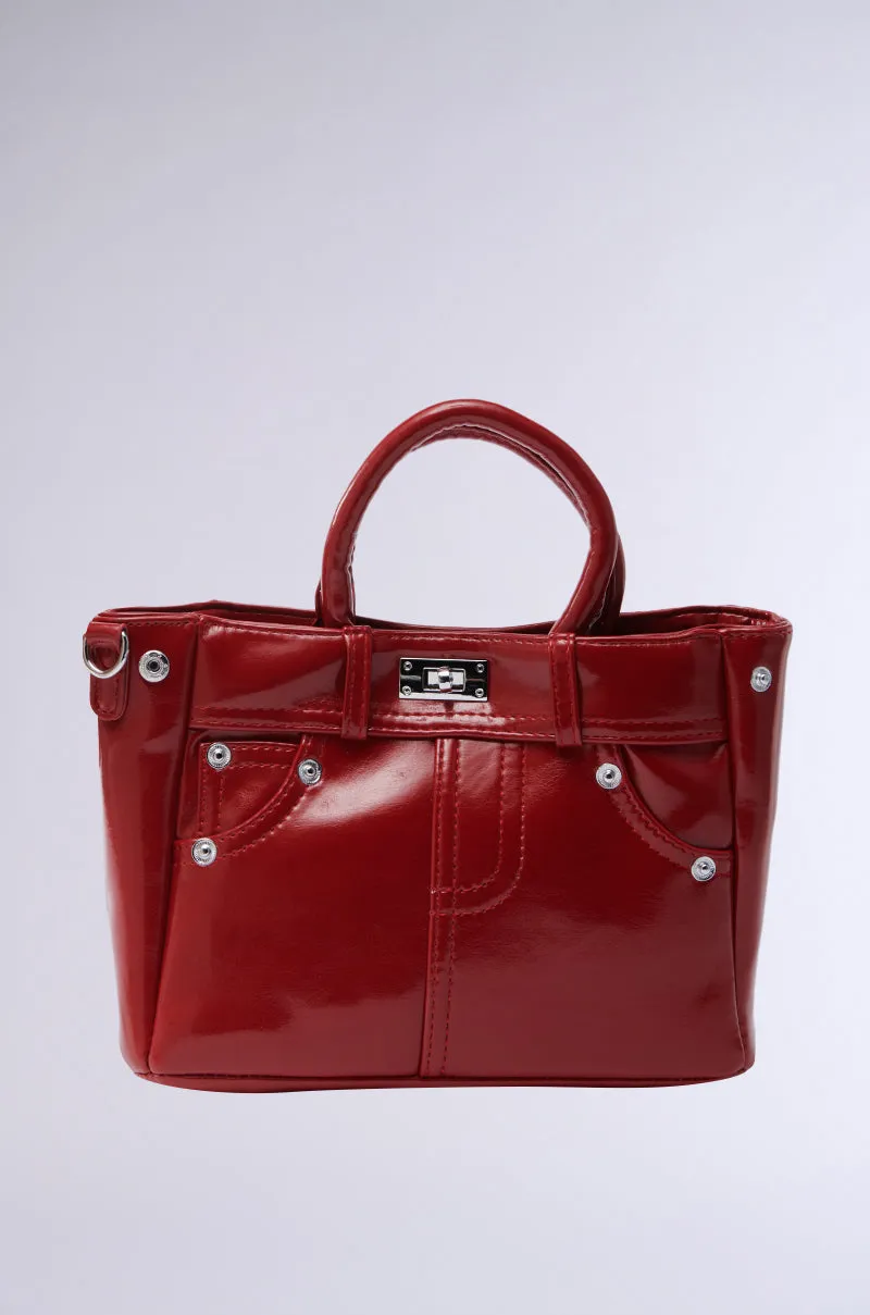 TOP TIER PANTS PU PURSE sold by AKIRA