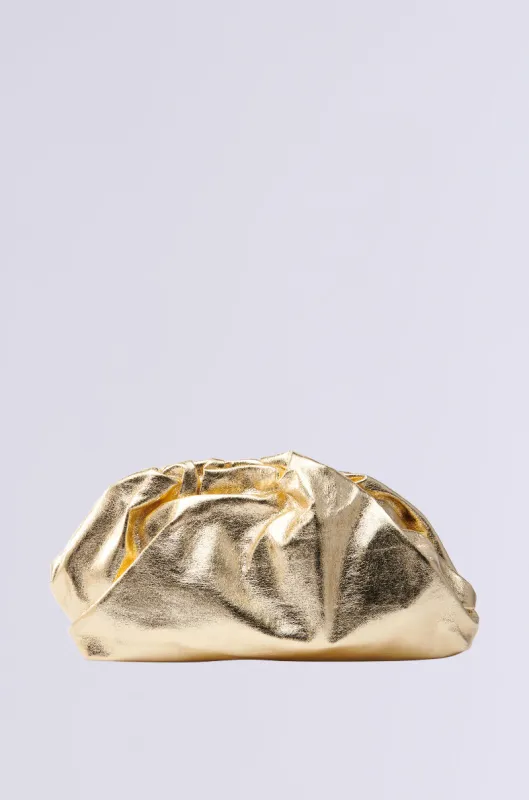 OVER IT METALLIC CLUTCH sold by AKIRA