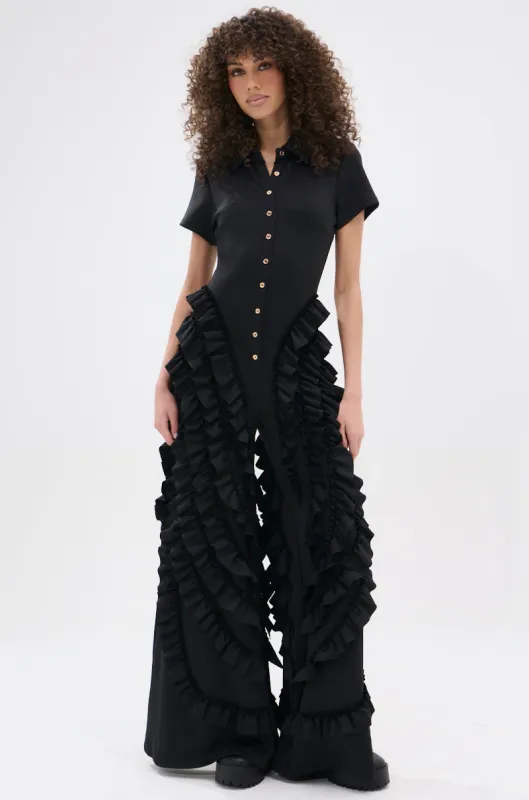 LEAVE IT RUFFLED JUMPSUIT IN BLACK sold by AKIRA