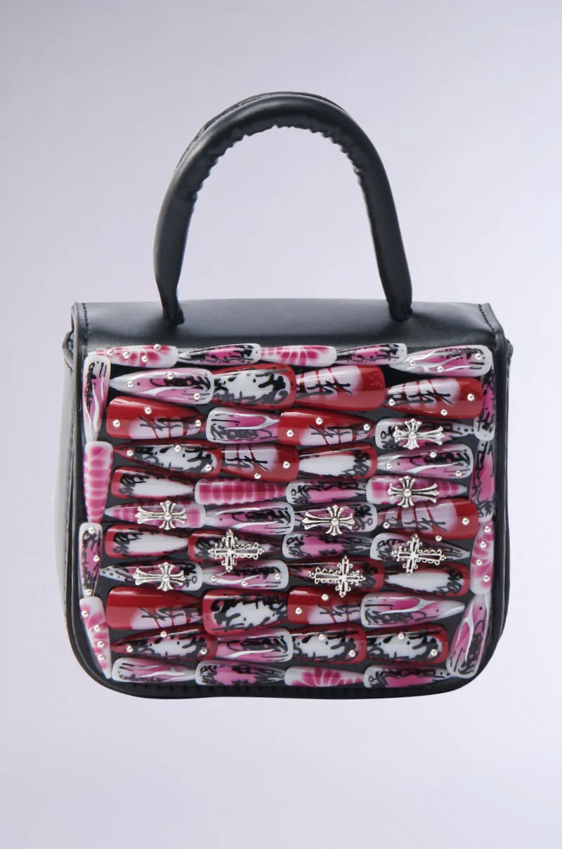 NAILED IT PURSE sold by AKIRA