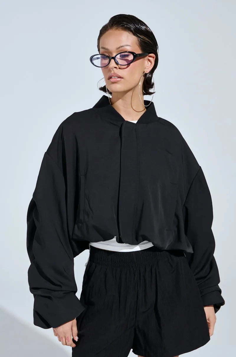 TREY RUCHED SLEEVE BOMBER sold by AKIRA