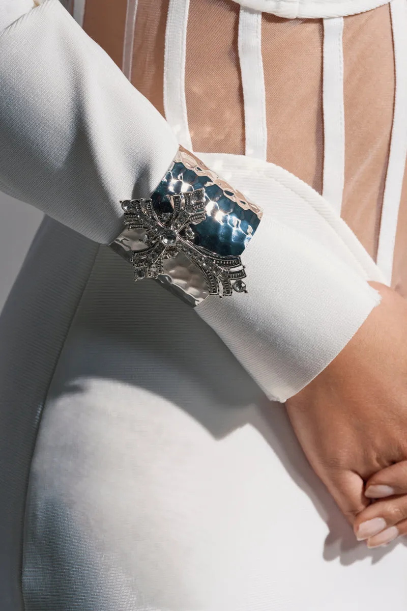 GIVING ENERGY CUFF sold by AKIRA