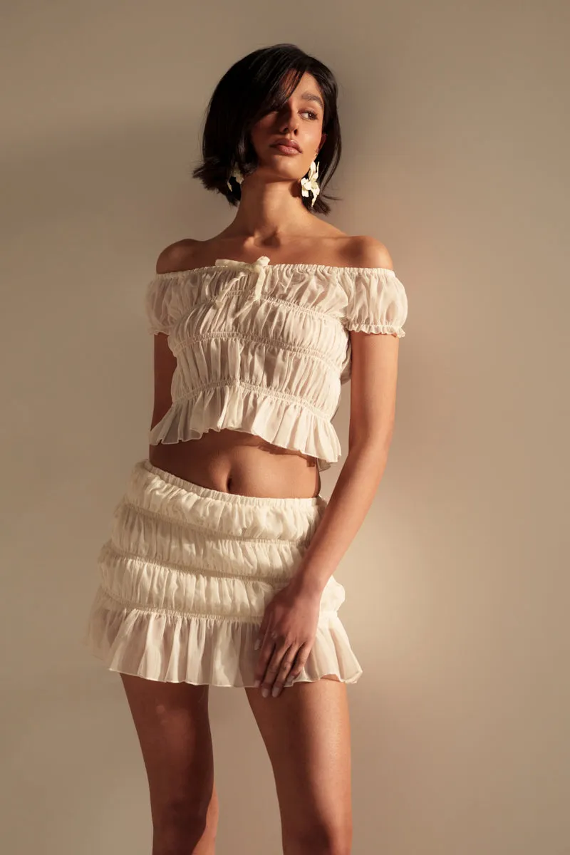 FLIRT WITH ME OFF THE SHOULDER BLOUSE sold by AKIRA